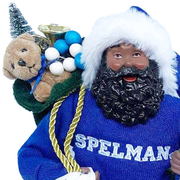 Close-up of Black Santa figurine face, curly beard and SPELMAN knit sweater