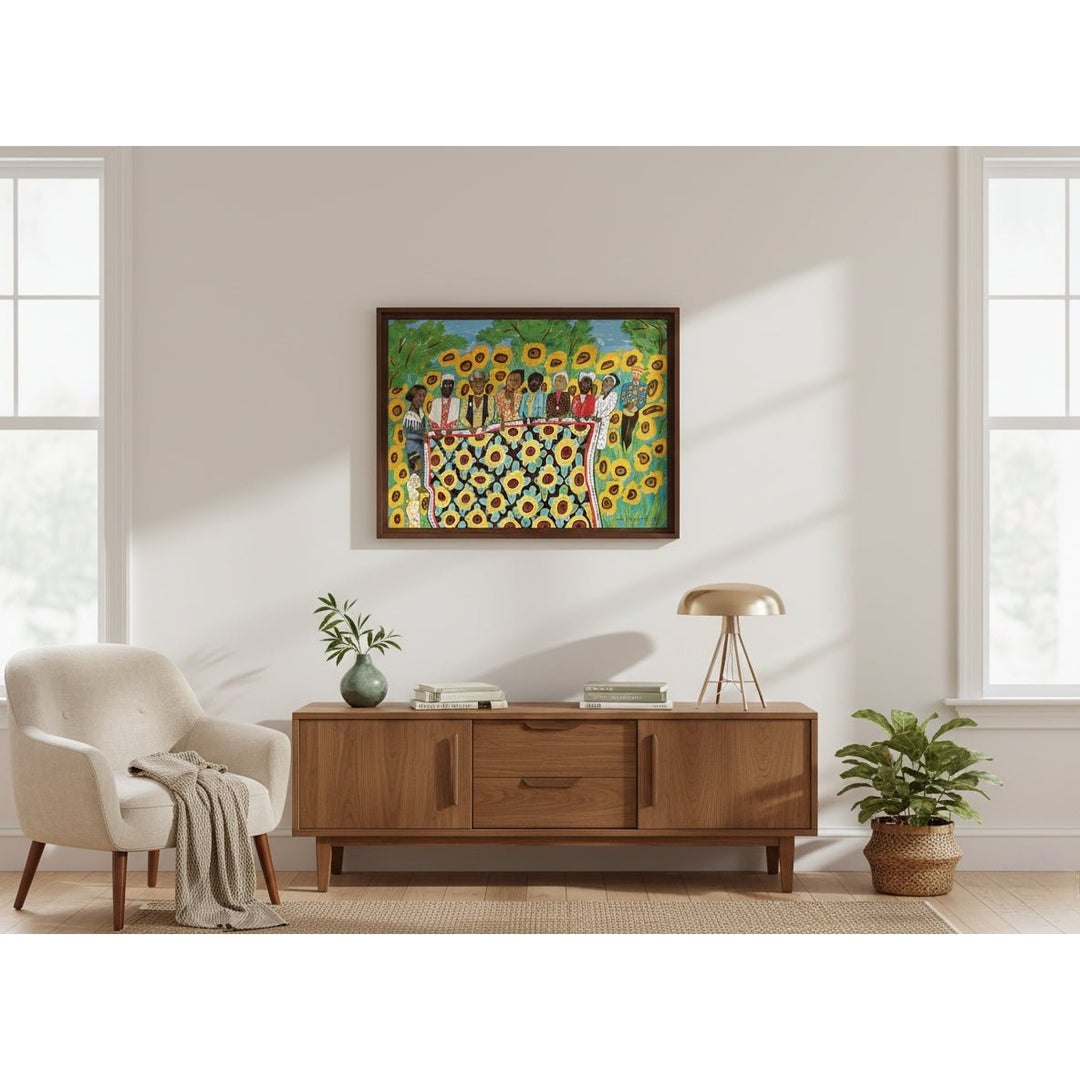 Sunflower Quilting Bee at Arles by Faith Ringgold: African American Jigsaw Puzzle (Lifestyle 2) - Living room with a wooden console table, beige armchair, and framed artwork of people around a table with sunflowers.