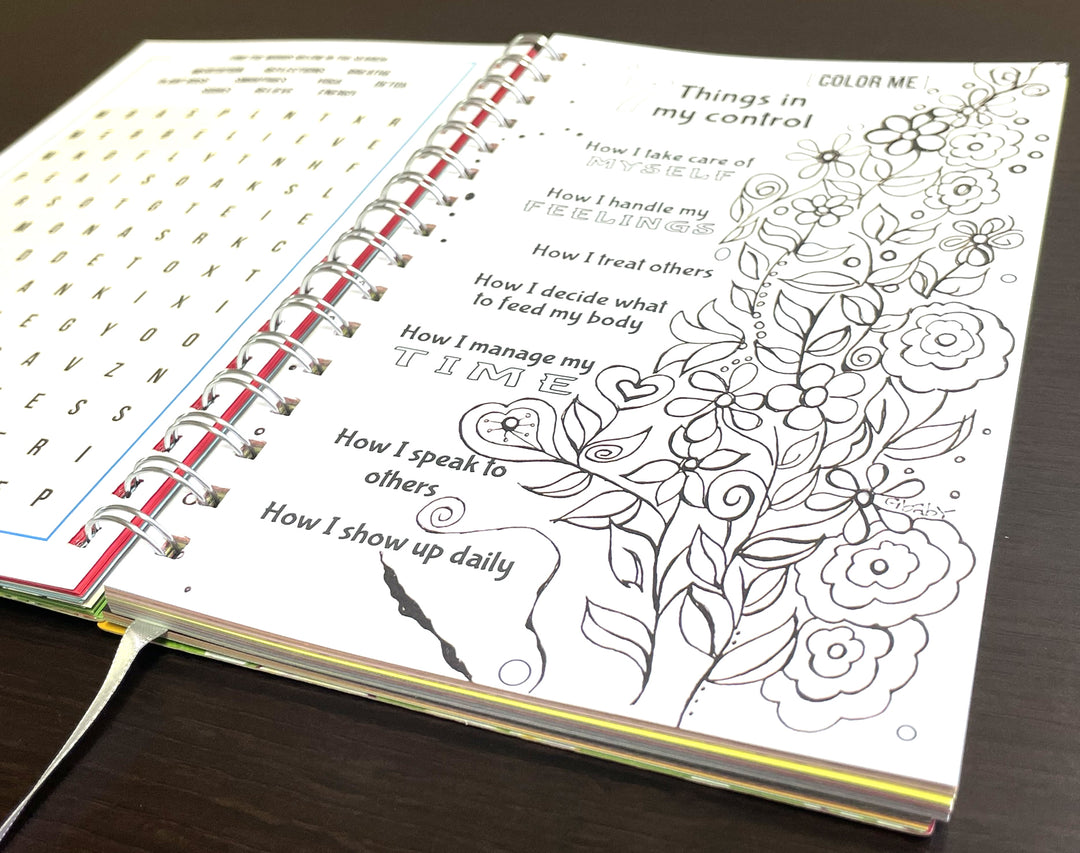 I Am Radiant by Syliva "Gbaby" Cohen: 2026 African American Weekly Inspirational Planner (Coloring Page) - Open book with coloring pages on a wooden surface