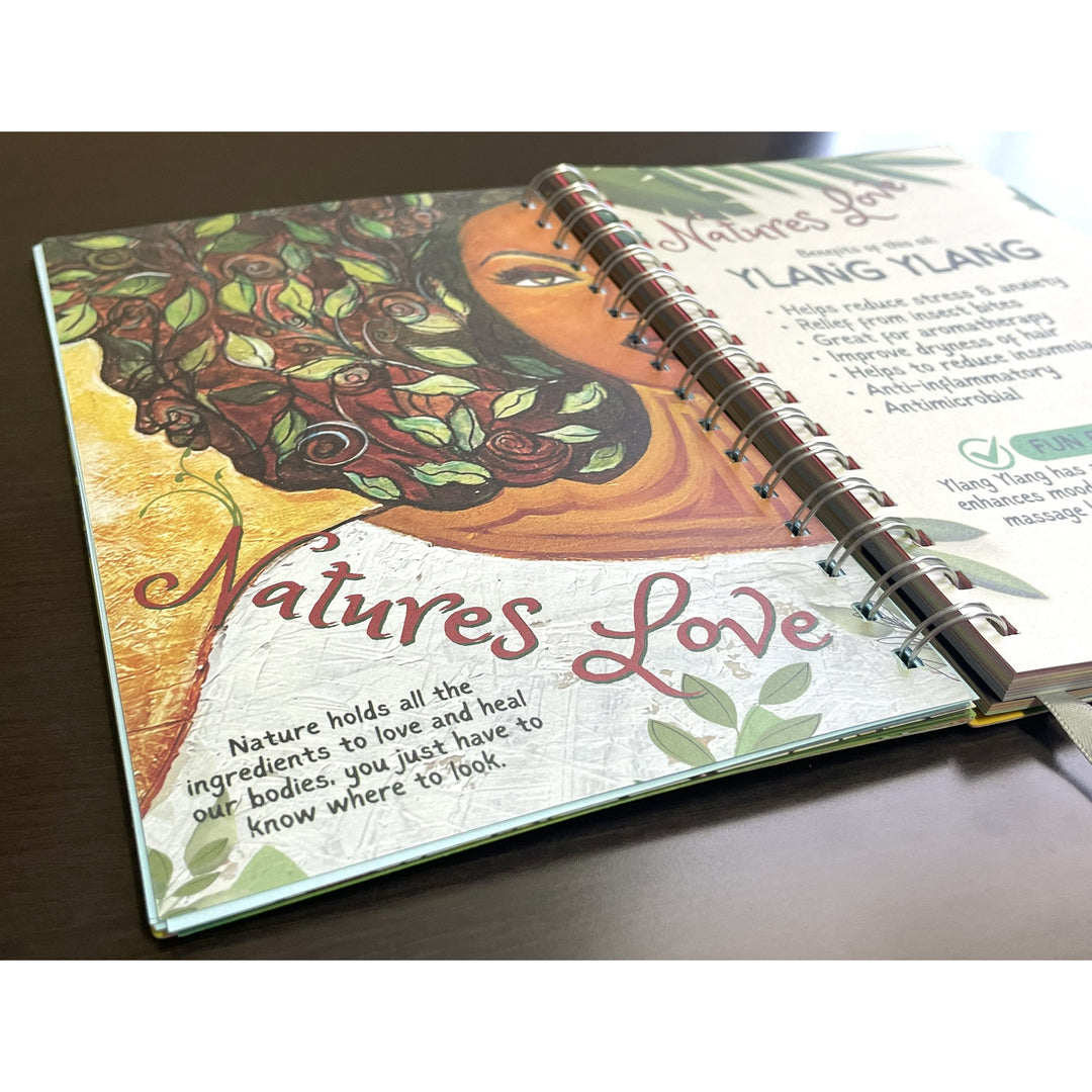 Be True to Yourself by Sylvia "Gbaby" Cohen: 2026 African American Weekly Inspirational Planner (Motivational Art) - Open book with nature-themed design and text on a wooden surface