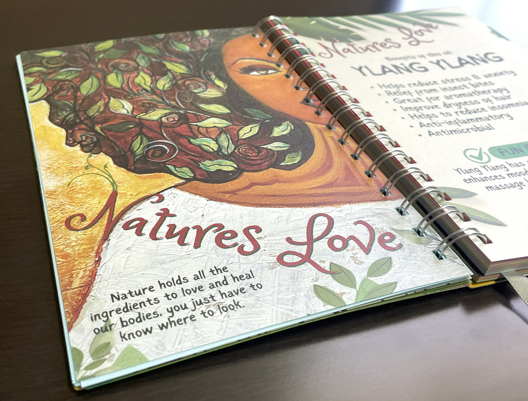 I Am Radiant by Syliva "Gbaby" Cohen: 2026 African American Weekly Inspirational Planner (Motivational Page) - Open book with nature-themed design and text on a wooden surface