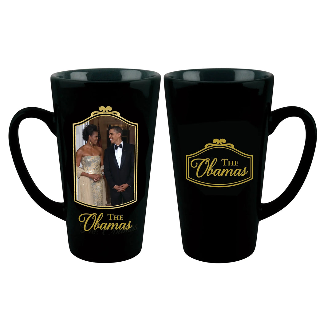 Class and Dignity: The Obamas Commemorative Ceramic Latte Mug (Main) - Two black ceramic coffee mugs shown on a white background, displaying the front and back designs. The front mug features a photo of The Obamas, and the back mug features a gold 'THE Obamas' logo.