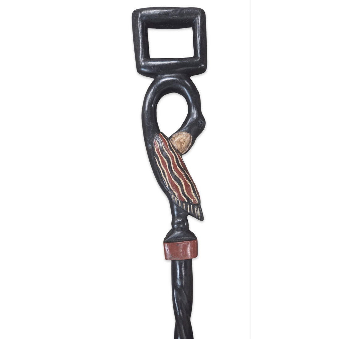 Tracing Roots (Sankofa): Decorative African Wooden Walking Stick (Handle Detail) - Decorative bottle opener with a stylized design on a white background