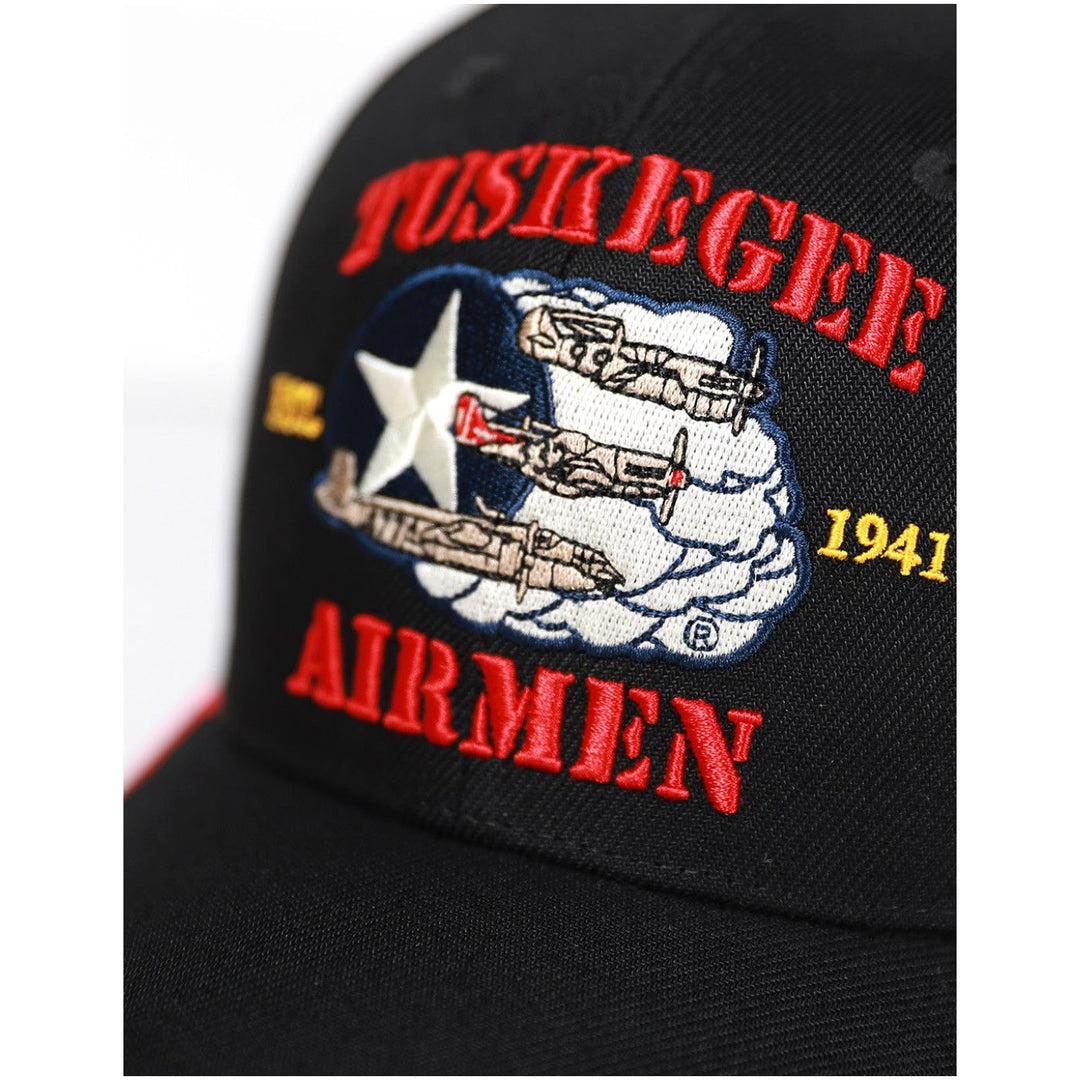 Tuskegee Airmen 99th Fighter Squadron Embroidered Baseball Cap (Front Detail) - Black cap with 'Tuskegee Airmen' text and airplane design on a white background