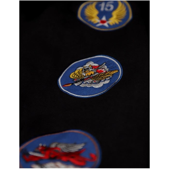 Tuskegee Airmen Squadron Patch Hooded Sweatshirt (Black, Sleeve Detail 2) - Close-up of military-style patches on a dark background
