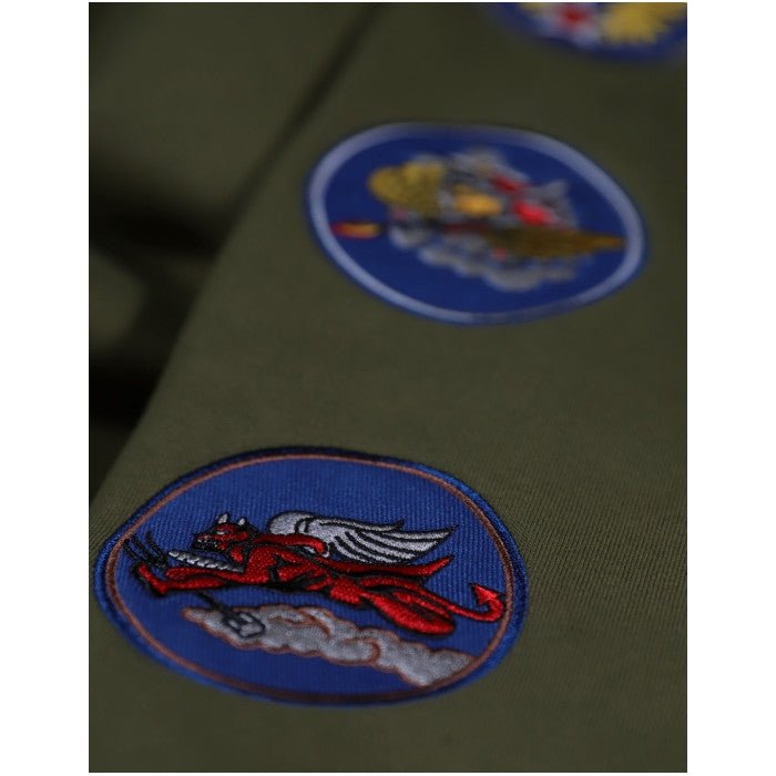 Tuskegee Airmen Squadron Patch Hooded Sweatshirt (Green, Sleeve Detail 2) - Close-up of military patches on a green uniform