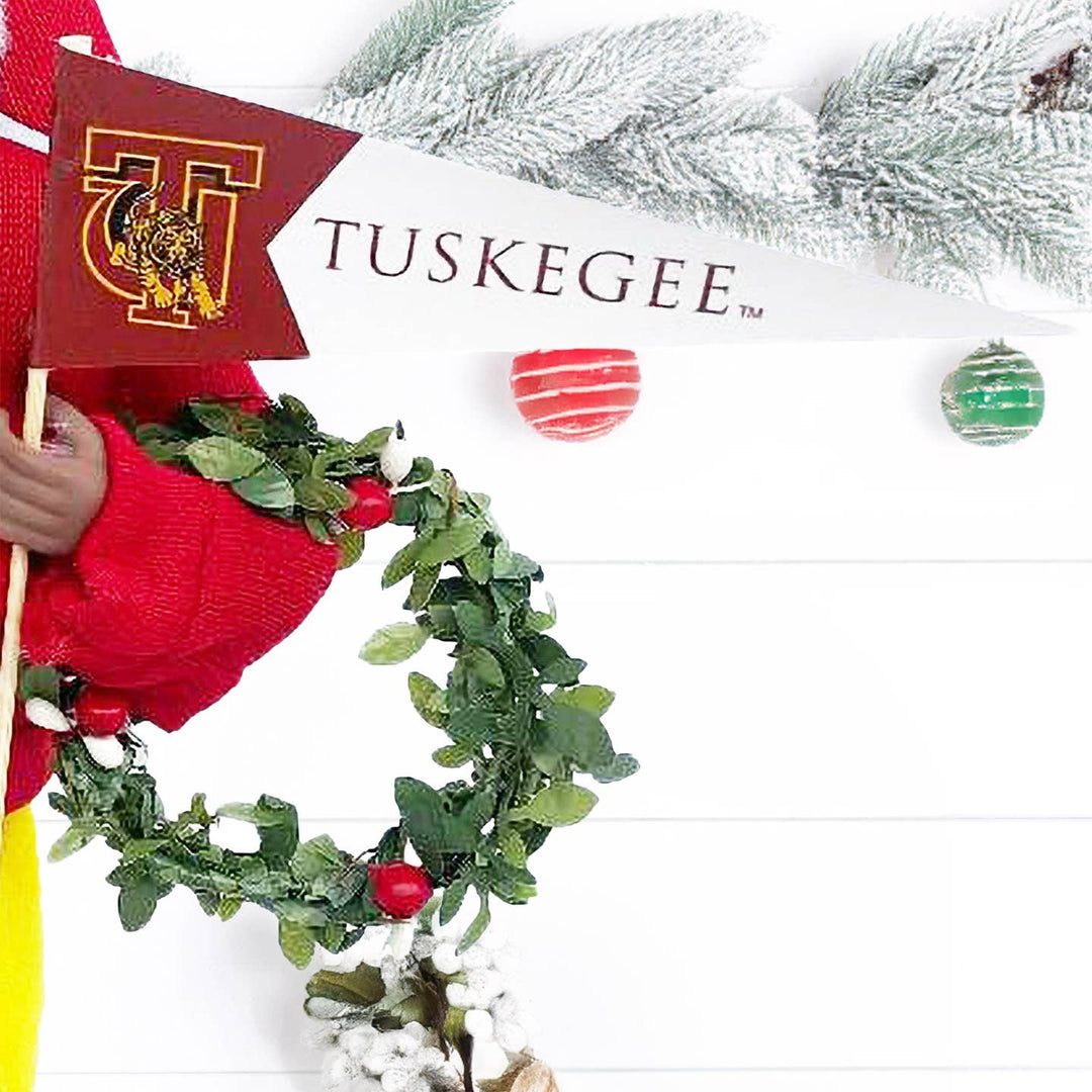 Crimson and gold TUSKEGEE pennant and berry wreath held by Santa figurine