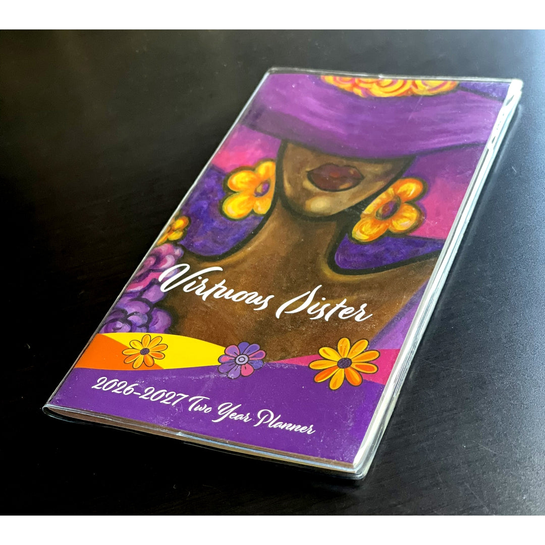Virtuous Sister by Pamela Hills: 2026-2027 Two Year African American Pocket Calendar (Lifestyle Photo 2) - Planner with a colorful design of a woman's face and flowers on a dark surface