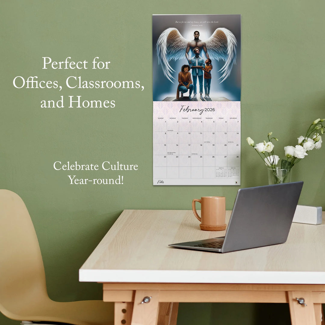 Walking by Faith: The Art of Keith Conner 2026 Wall Calendar (Lifestyle) - Calendar on a wall above a desk with a laptop and mug, against a green wall.