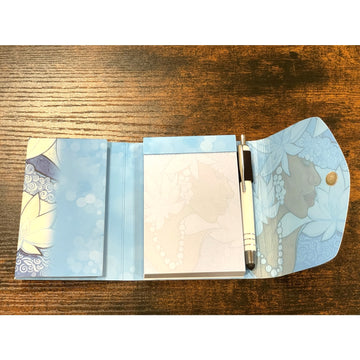 Winter Stylus Purse Pal by Pamela Hills (Interior) - Notebook with blue floral design on a wooden surface