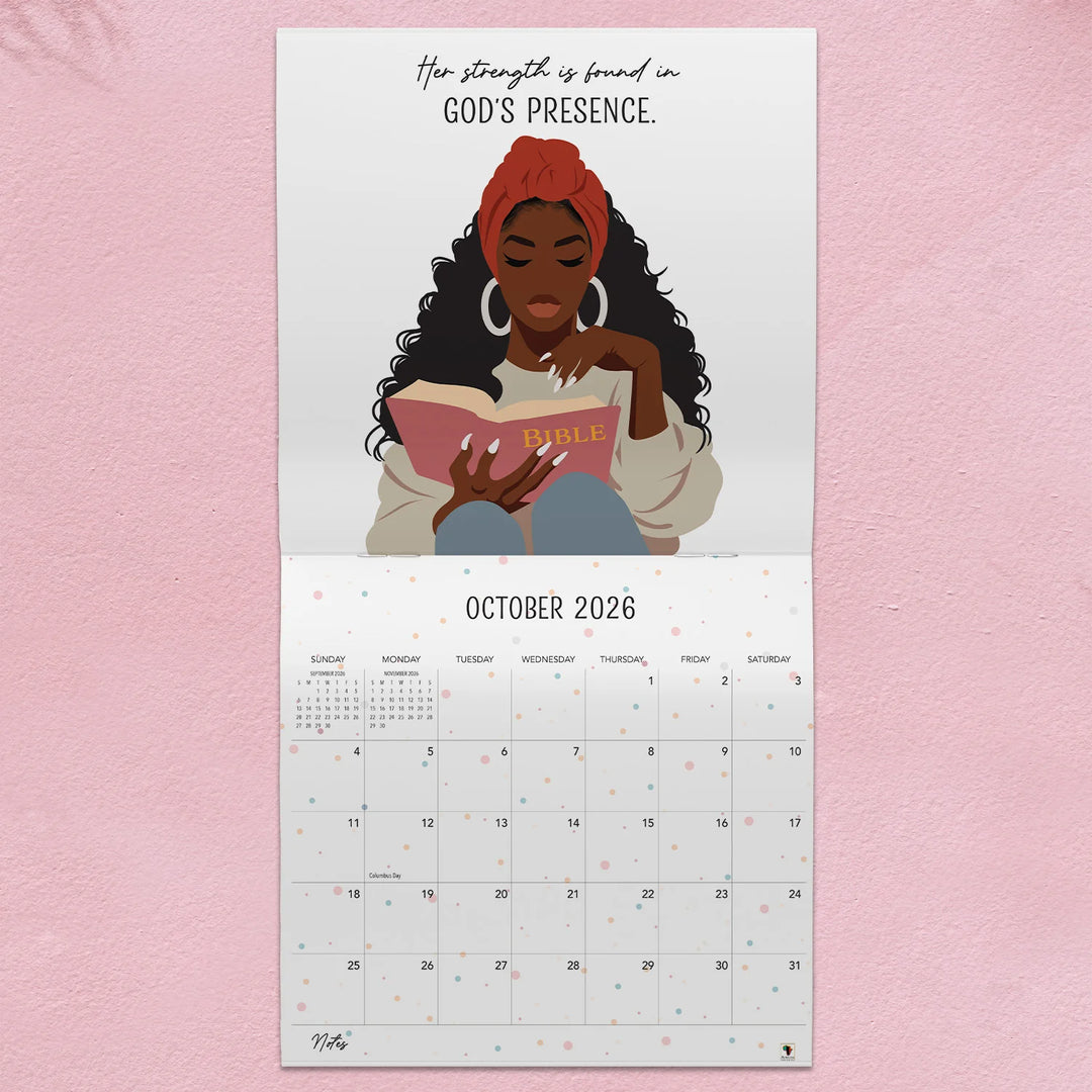 A Woman Who Walks With GOD: The Art of Nicholle Kobi 2026 Wall Calendar (Interior) - Calendar with illustration of a woman reading a Bible on a pink background